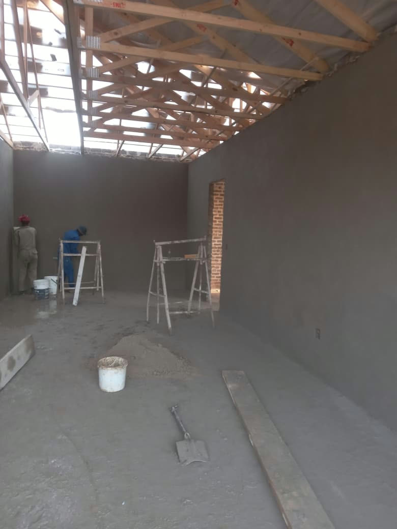 Team plastering a new build interior