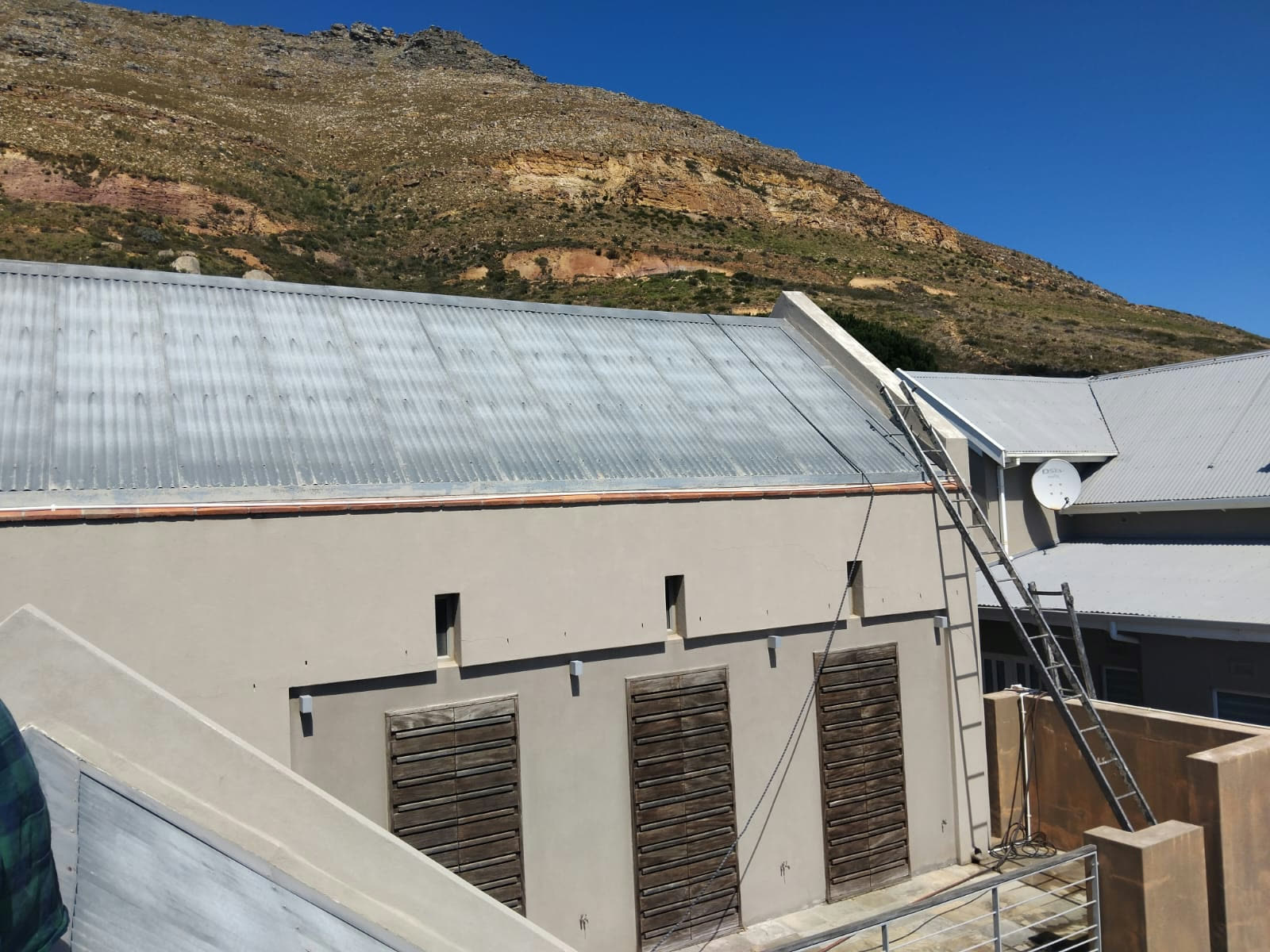 Roof and gutter work on a mountain-side home