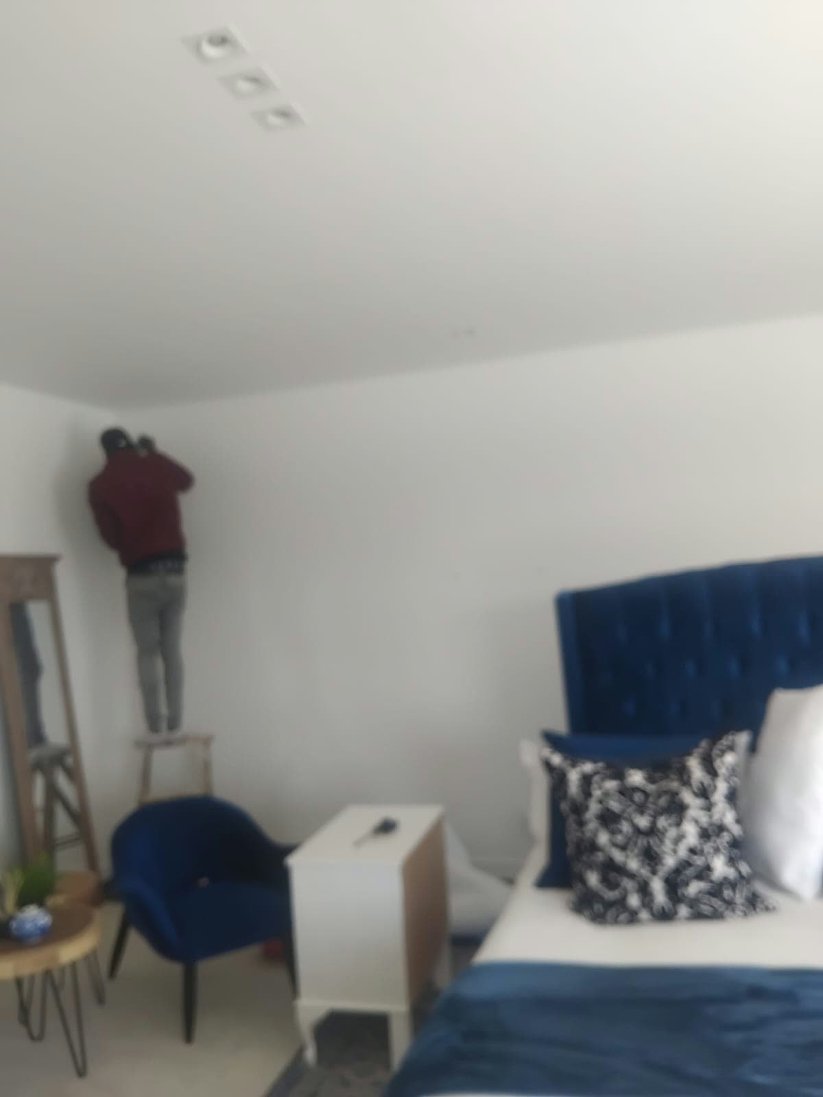 Finishing touches on a guest bedroom